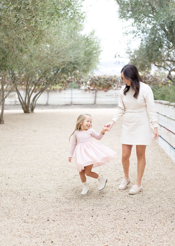 best-locations-for-family-photos mother and daughter dancing during the best locations for family photos